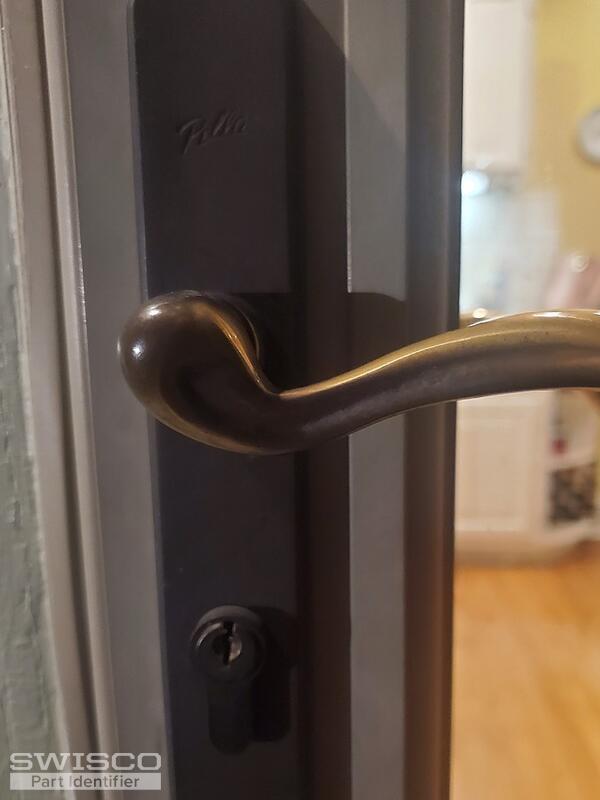 Storm door lock spins