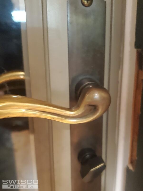 Storm door lock spins