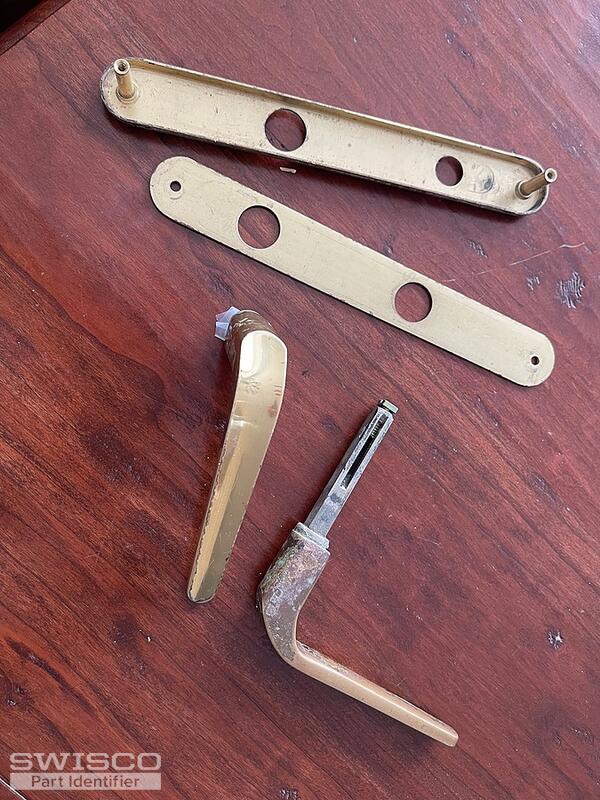 Storm door latch broken and stuck in door jam