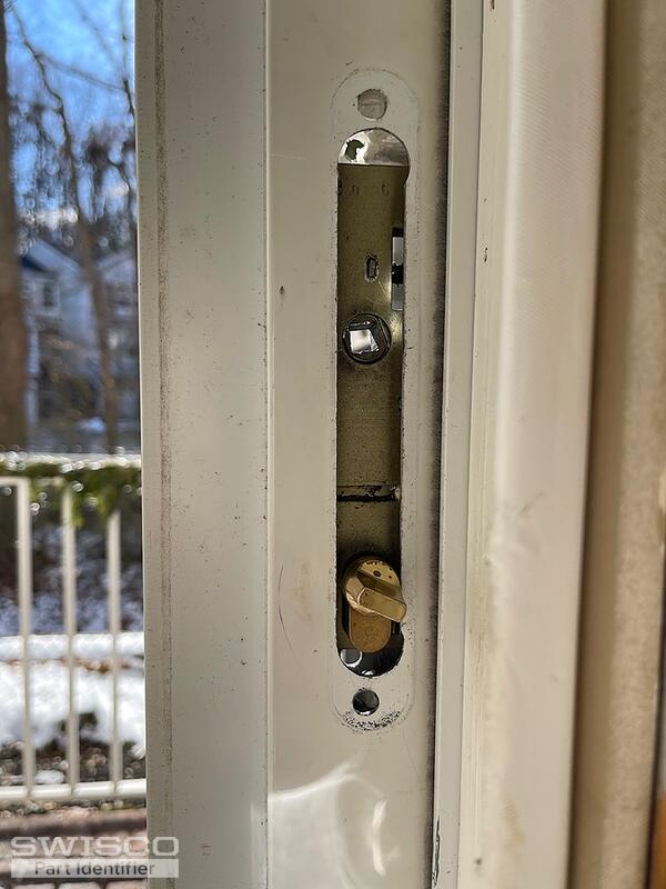 Storm door latch broken and stuck in door jam