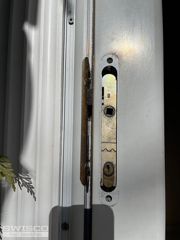 Storm door latch broken and stuck in door jam