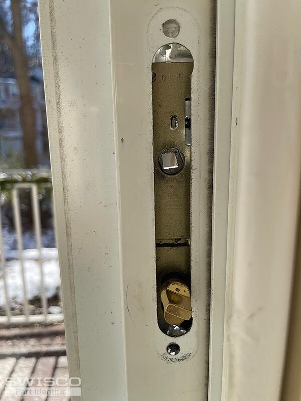 Storm door latch broken and stuck in door jam