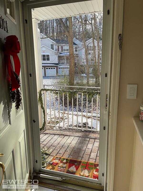 Storm door latch broken and stuck in door jam