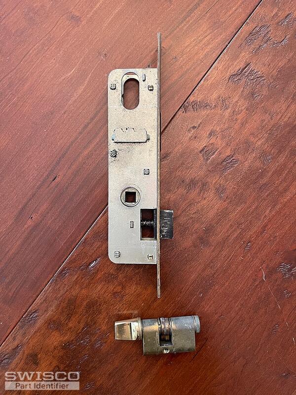 Storm door latch broken and stuck in door jam