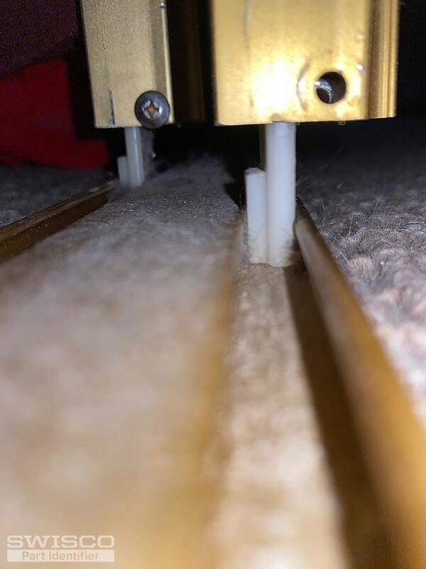 Bottom track guide for bypass doors