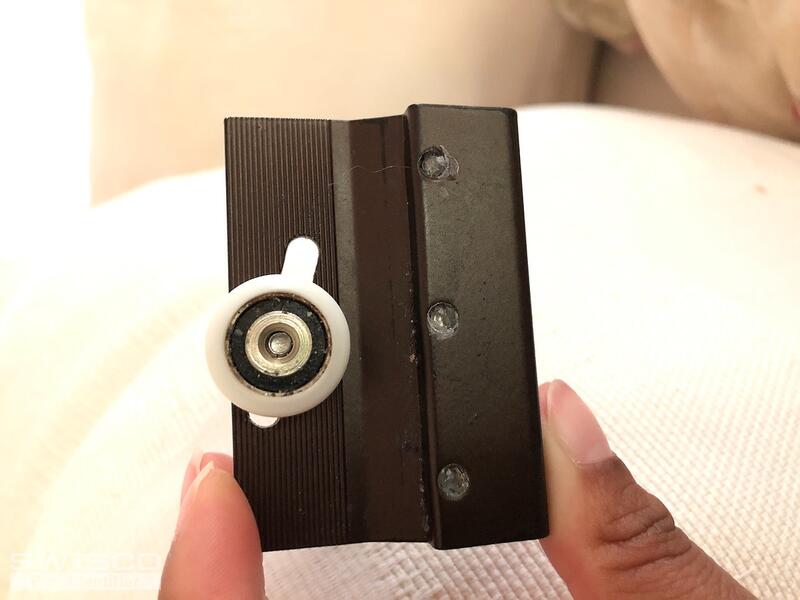 Sliding shower door hanger