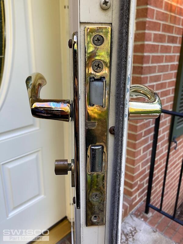 Storm door locking handle