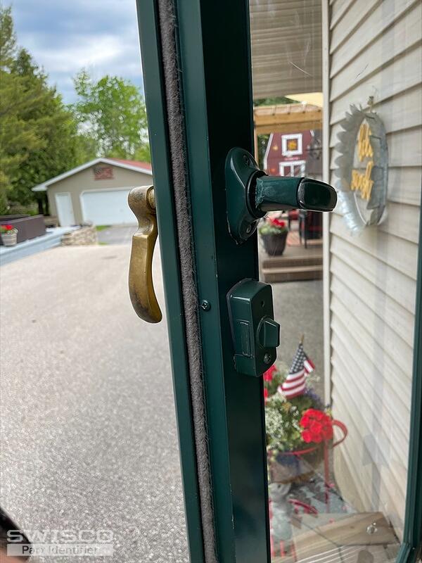 Storm door latch mech