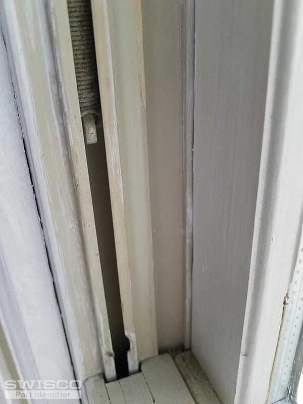 LOWER SASH  LEFT SPRING DISCONNECTED