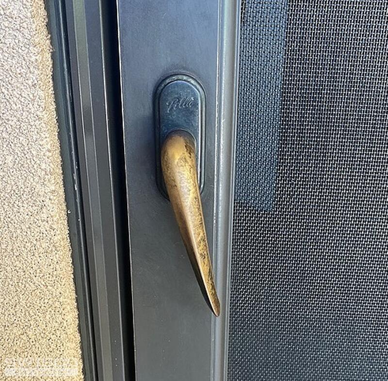 Screen door handle spring