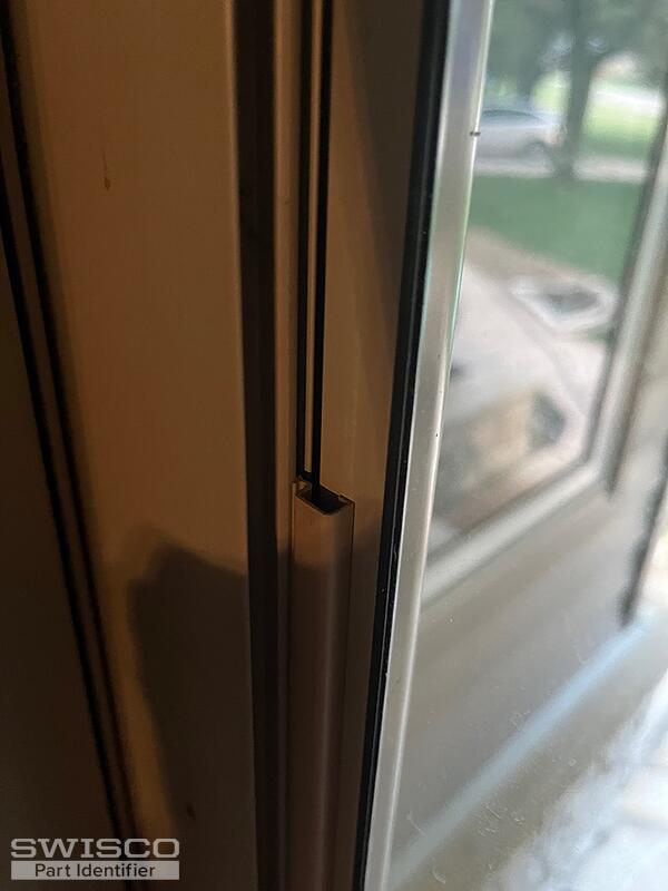 Larsen storm door holds window in place