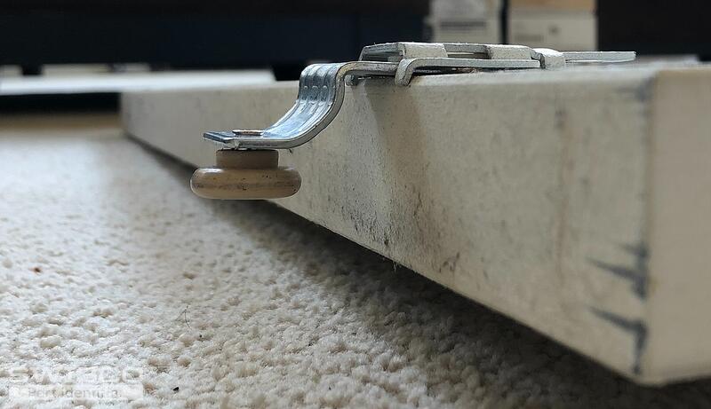 Sliding door rollers - mounted on door side view 1