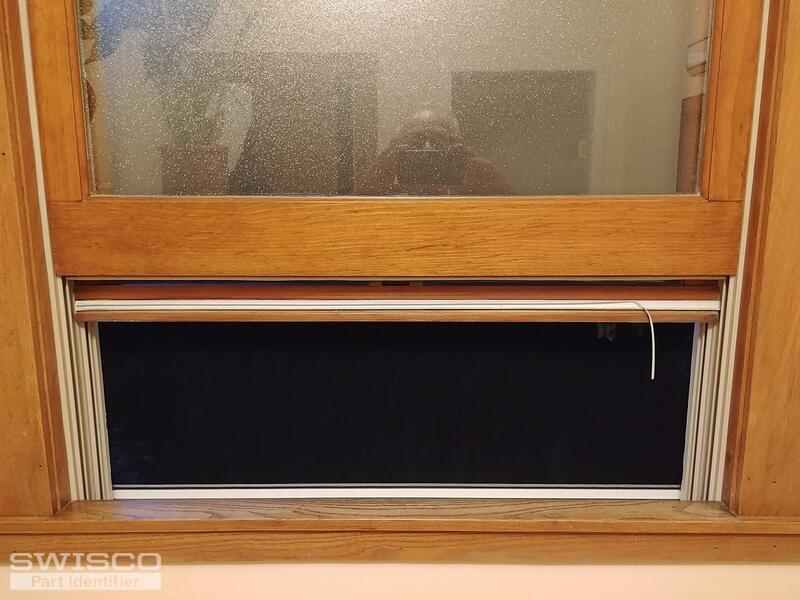 Weather stripping on bottom rail of Marvin double hung wood tilt pac