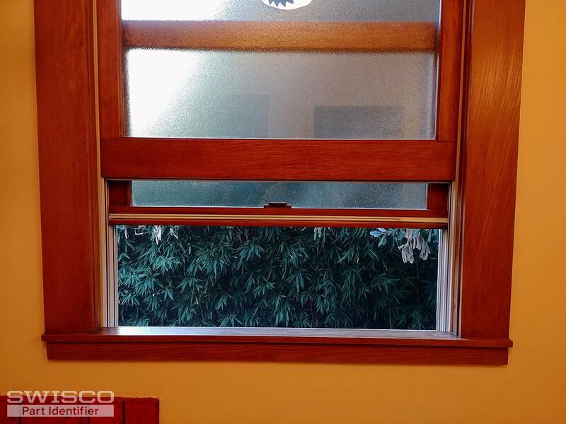 Weather stripping on bottom rail of Marvin double hung wood tilt pac