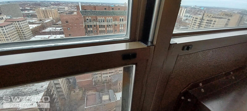 Bottom sash release button