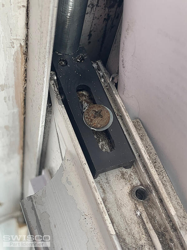top sash guide against spiral balance