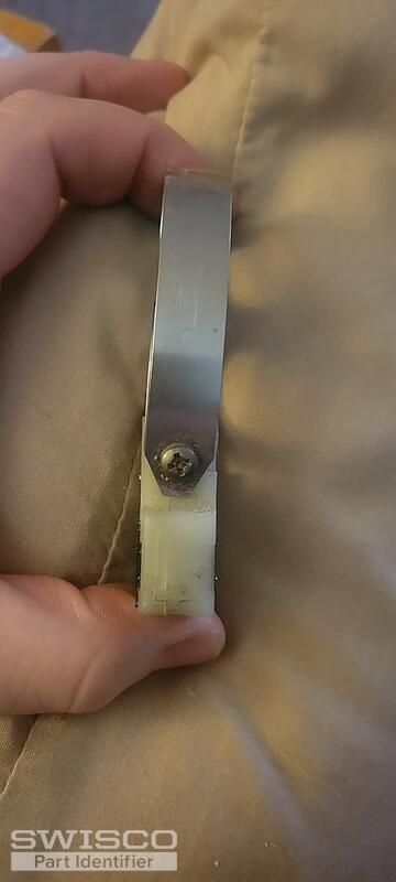 spring screwed to side of shoe