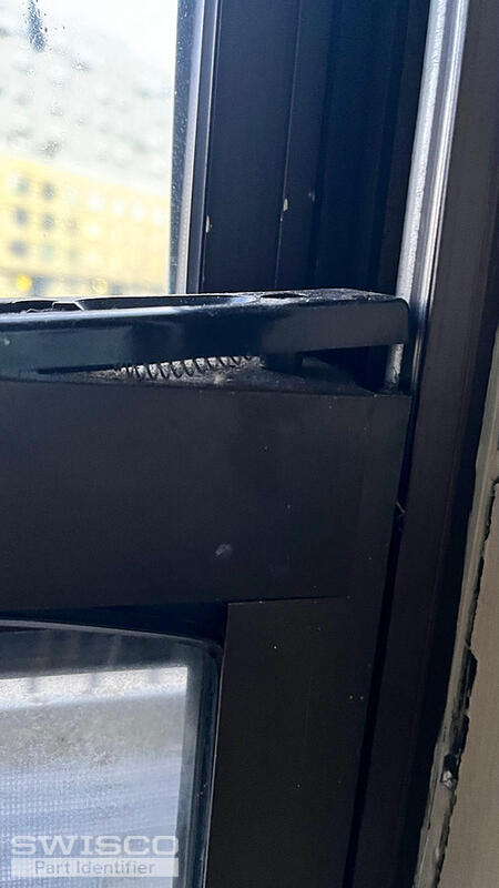 spring loaded tilt latch