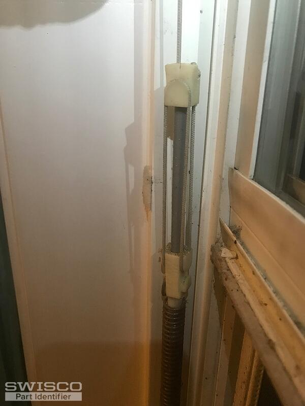 Fitting at top of rod and attached to spring