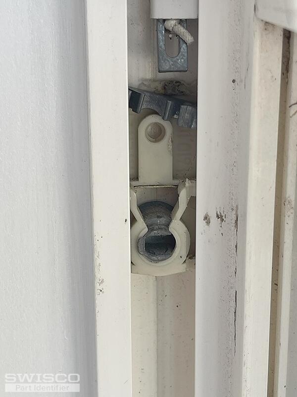 Shoe with part to hold spring