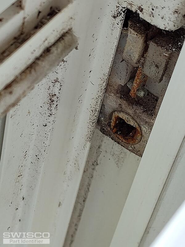 plastic receptacle w rusted pin lodged in it