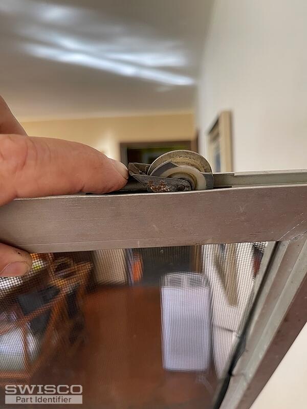 Patio door screen slider roller assembly