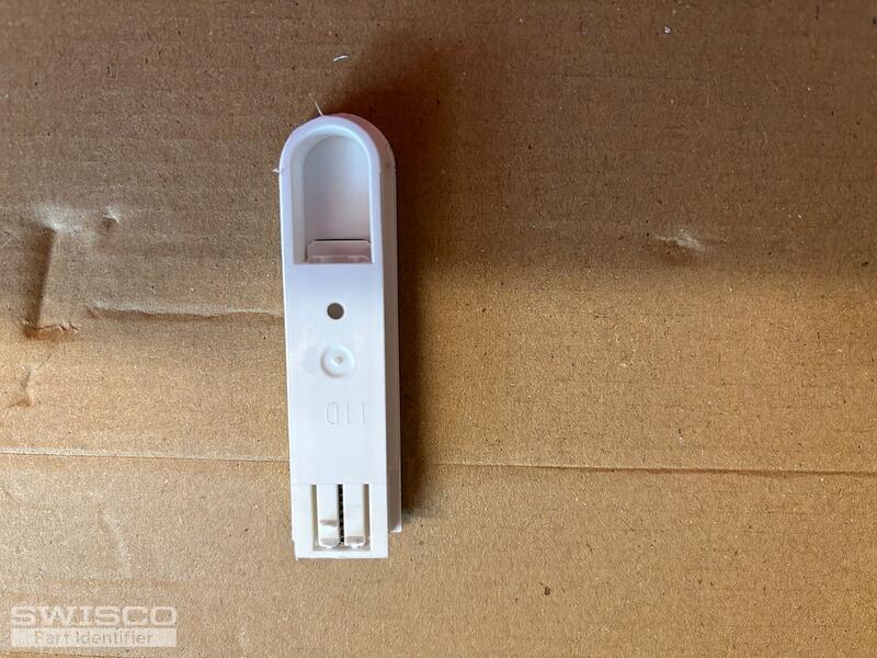 Bottom side of broken (right) tilt latch
