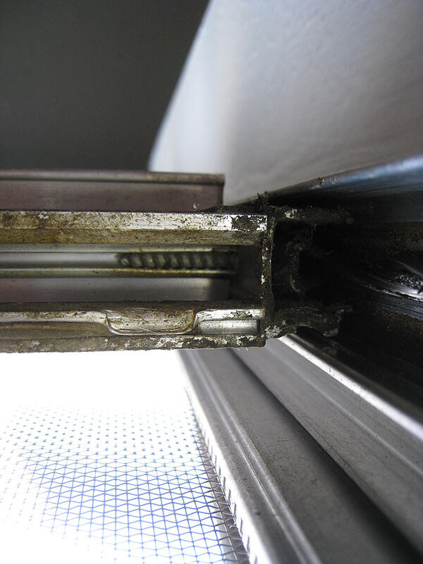 4 looking up into bottom of window screw visible