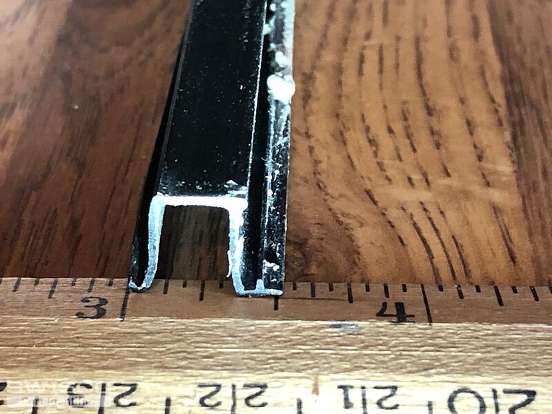 Storm window retainer