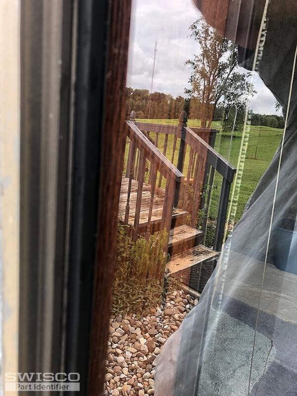 Storm window retainer
